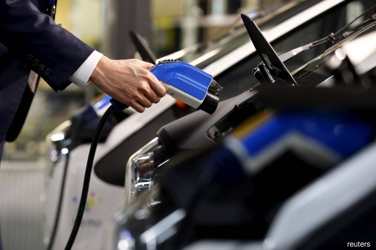 China to consolidate overcrowded electric vehicle industry, says minister